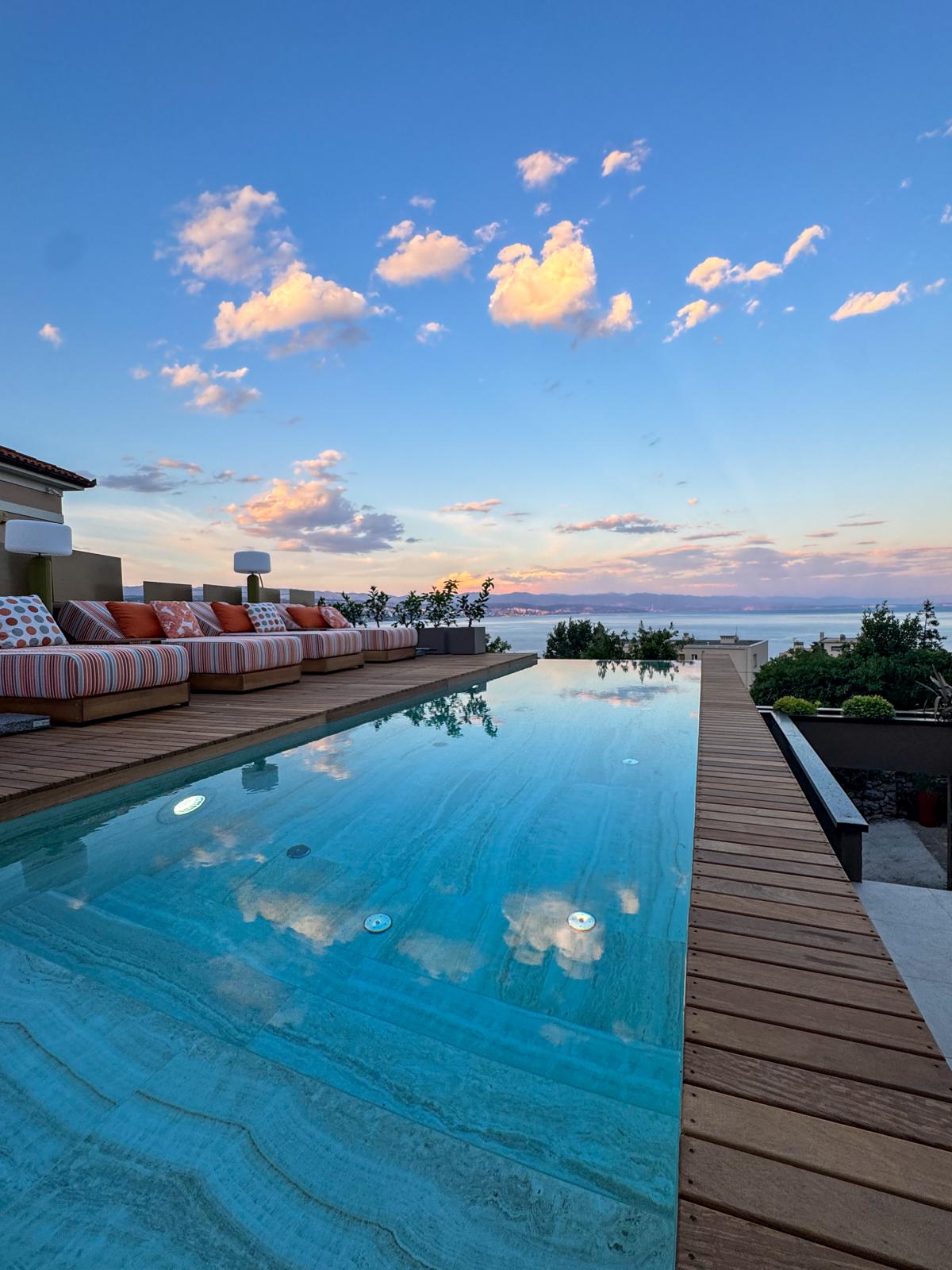 Private infinity pool at sunset with sea views over the Kvarner Bay, IBoutique Luxury Villa Opatija